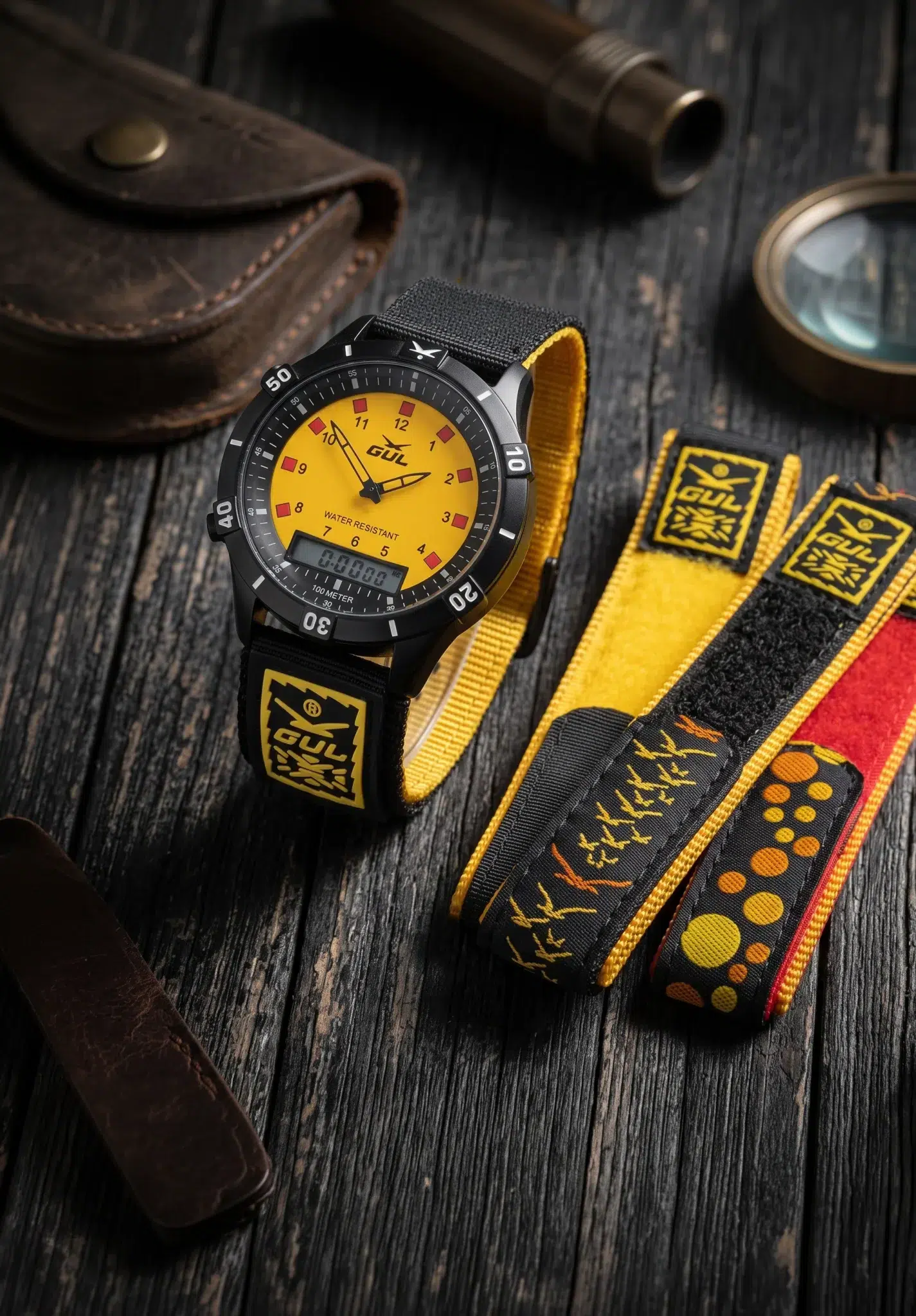 banner ana digi watch with velcro straps on wooden surface